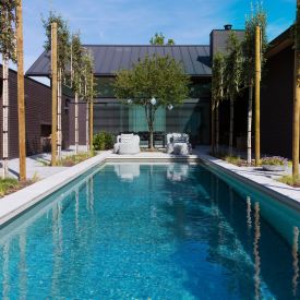 Met een zwembad in uw tuin voelt thuis zijn als vakantie